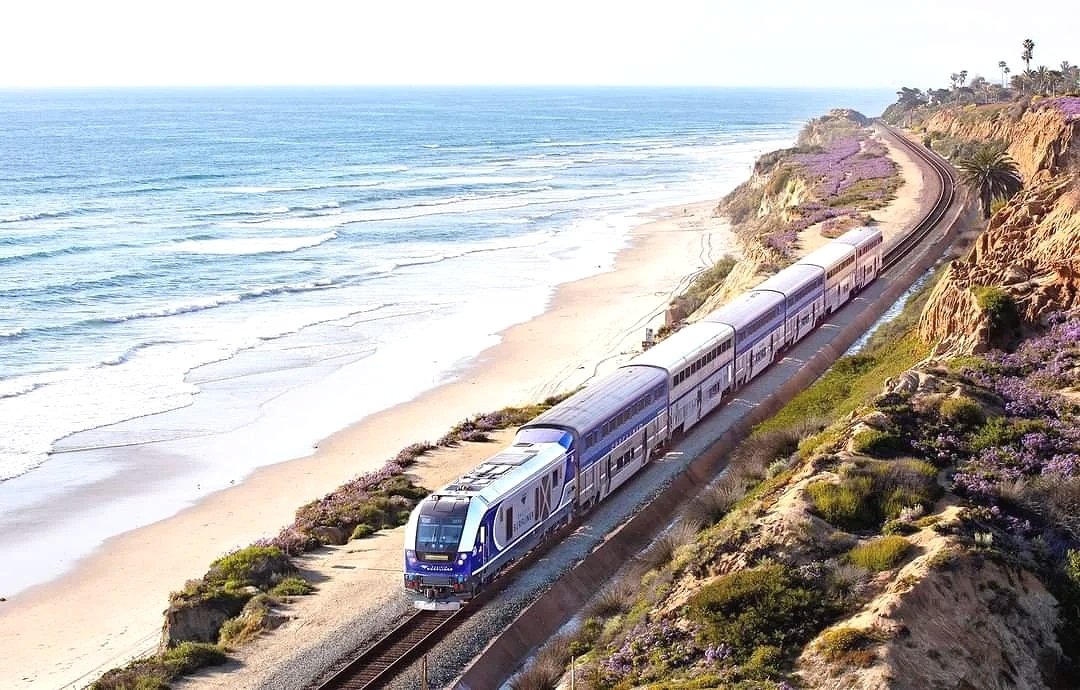 Passenger train beside the Pacific coastline